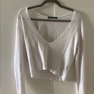 Low cut white knit shirt